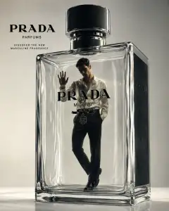 A man dressed in a white silk shirt and black trousers stands inside a large transparent glass perfume bottle with subtle reflections and highlights, embodying luxury fragrance advertising.